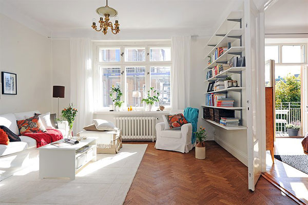 white-interior-design-modern-living-room-with-natural-lighting-from-windows-and-a-small-library