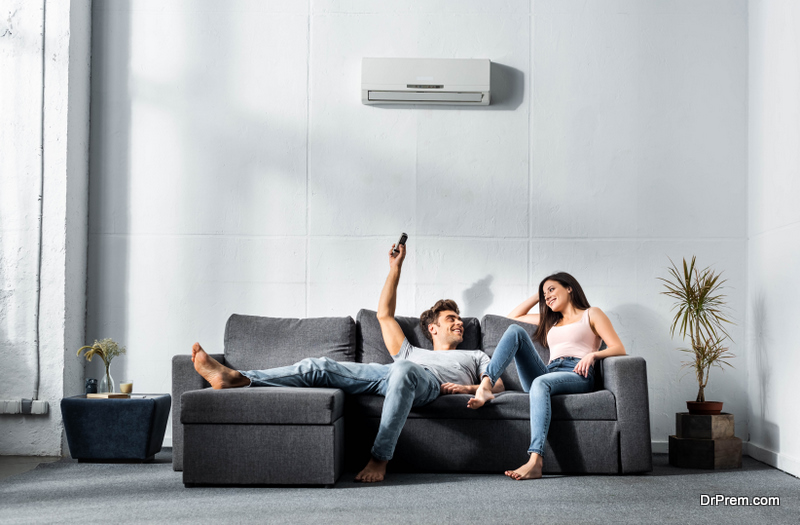  couple enjoying comfort of ac unit