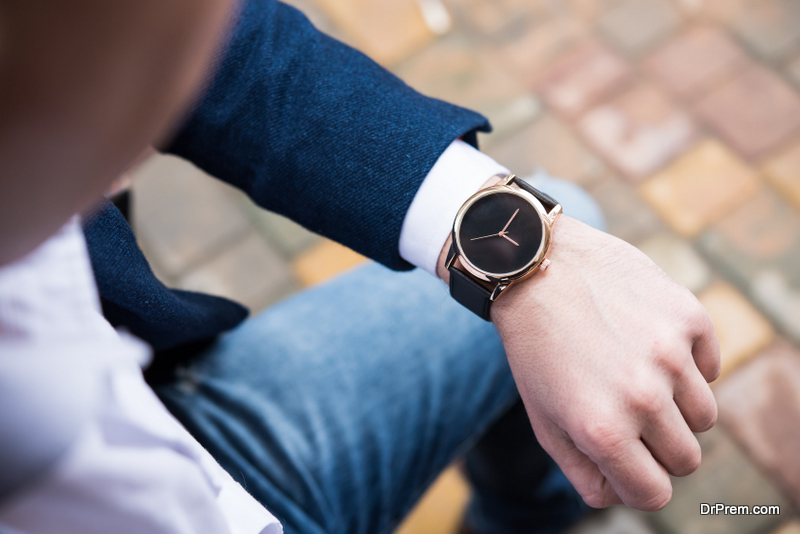 man looking at wrist watch