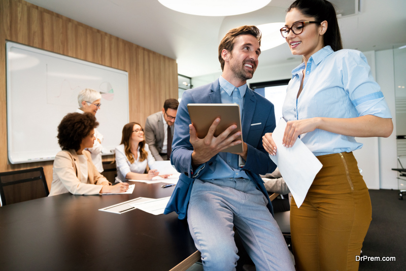 Collaboration and analysis by group of business people working in office