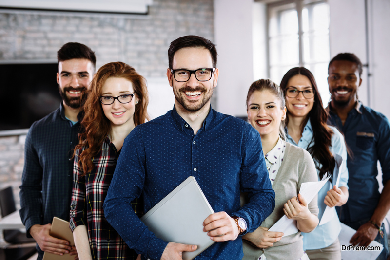 Portrait of successful young business team posing in office